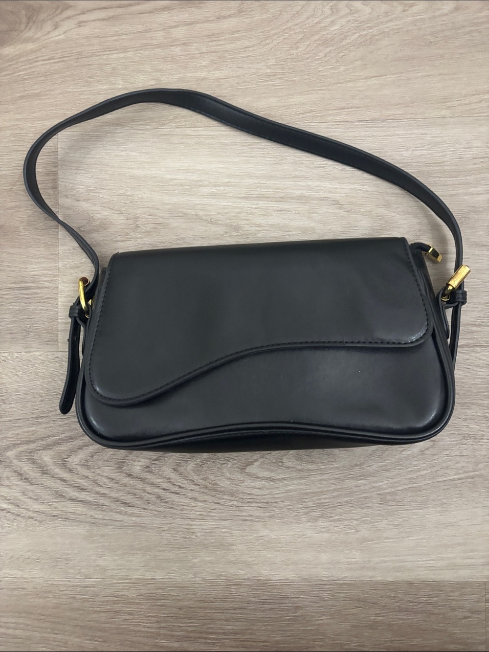 Minimalist Black Leather Shoulder Bag with Gold Hardware